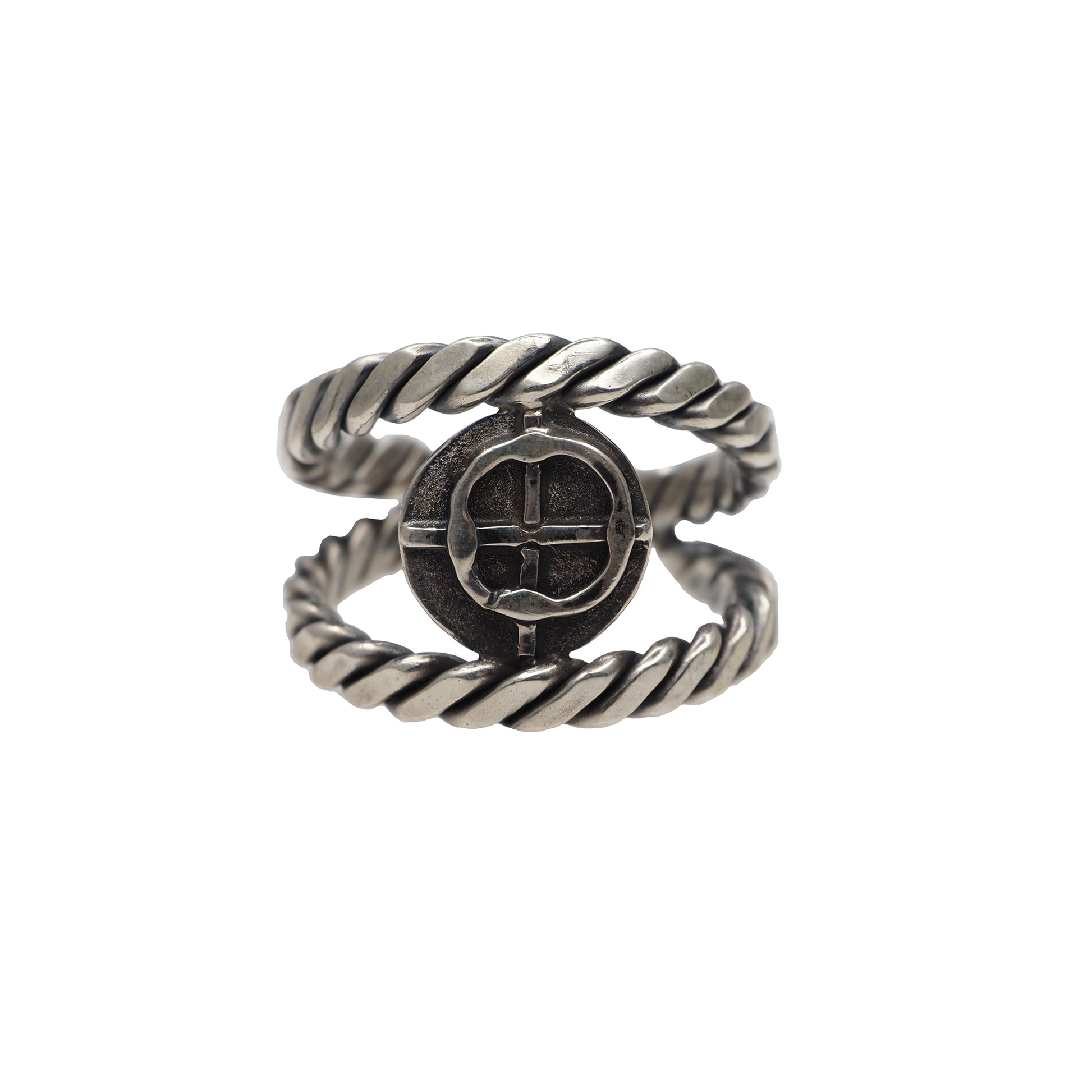 silver rope ring with cross coin in the center in the pirate style on the white background