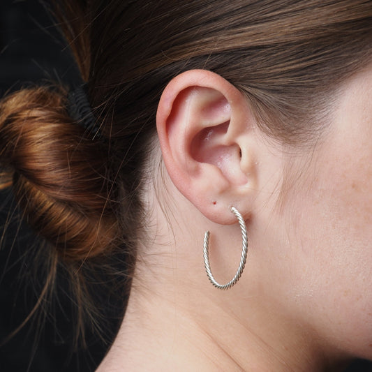silver hoop earrings on a girl