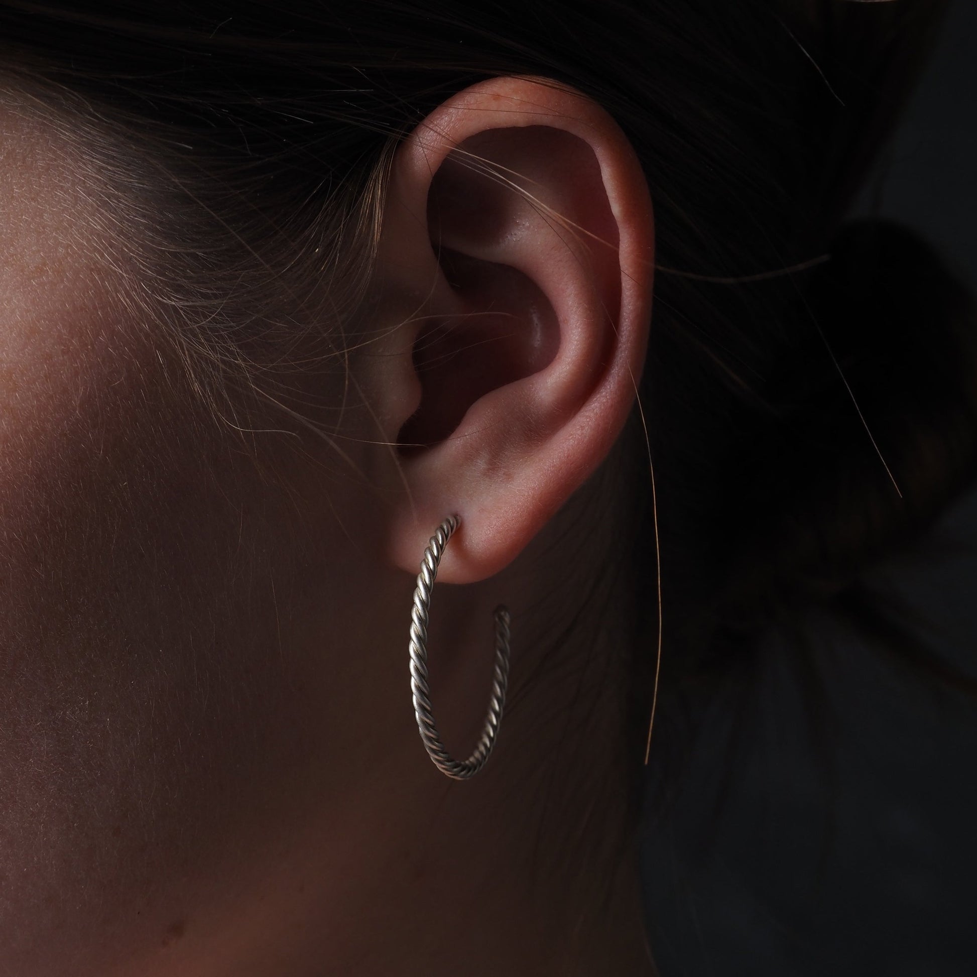 silver hoop earrings on a girl